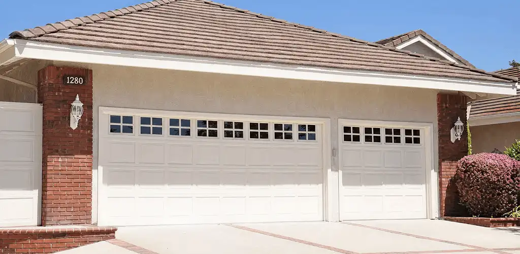 Residential garage door repair service for a double garage door in Bloomington, IN