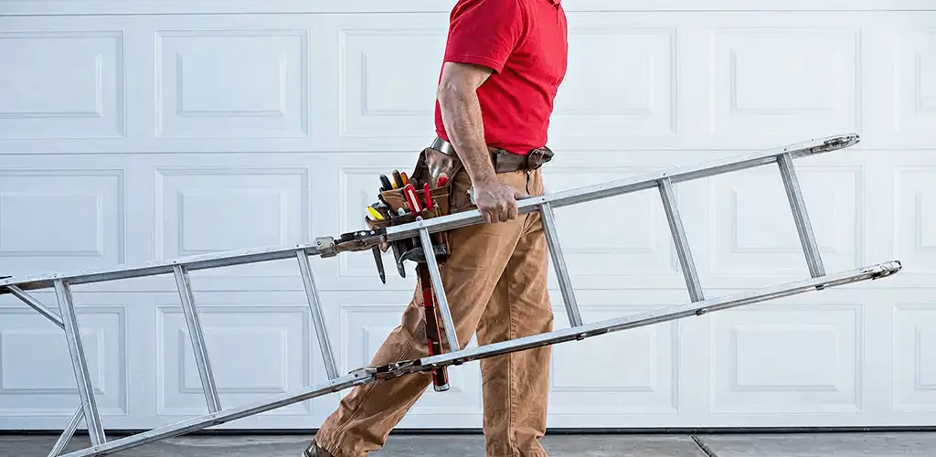 Garage door repair technician arriving with tools and ladder in Bloomington, IN