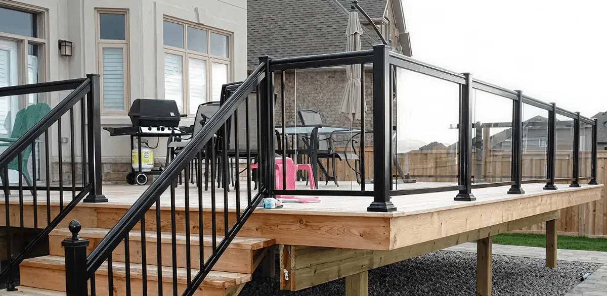 Handrail installation on a deck staircase for safety and code compliance in Bloomington, IN