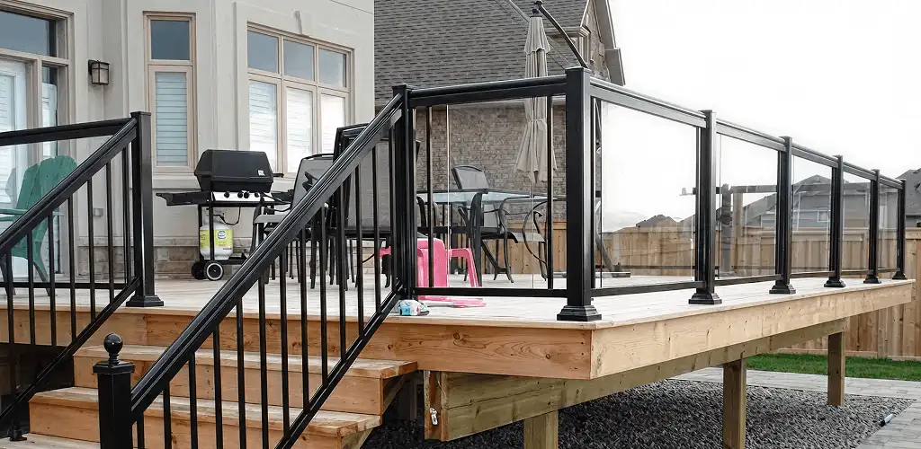 Handrail installation on a deck staircase for safety and code compliance in Bloomington, IN